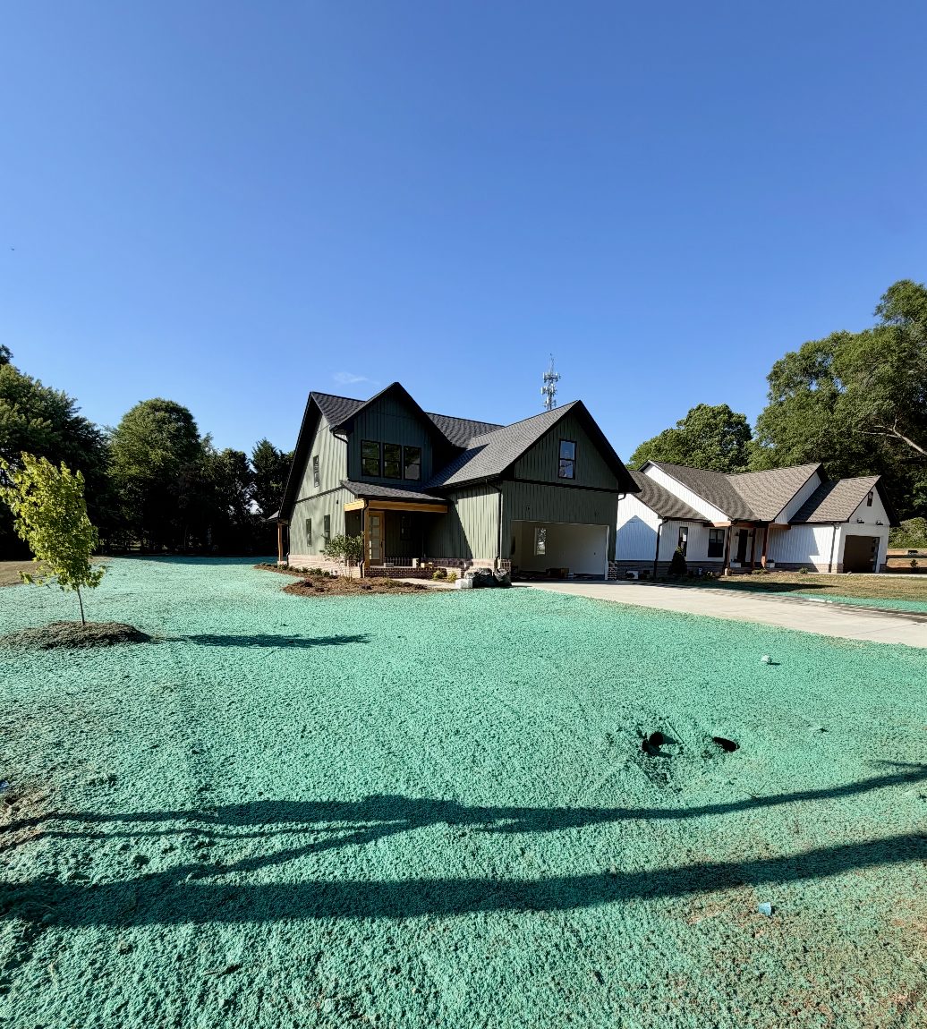 Gray ranch home with a new hydroseed lawn and willow tree in the Catawba Valley NC