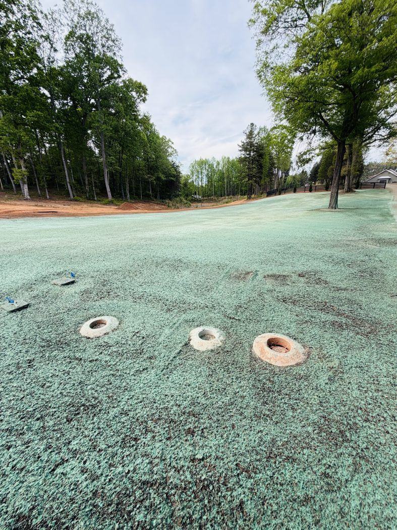 Residential backyard hydroseed application around septic risers