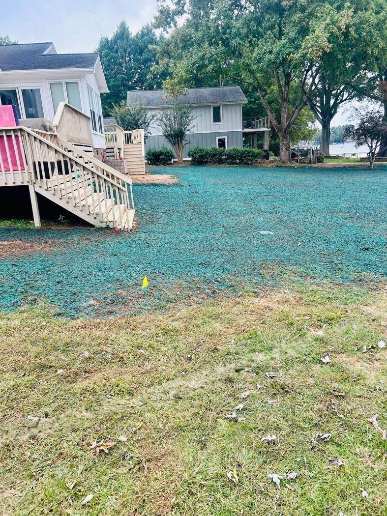 Lakefront home with freshly hydroseeded side yard, NC Piedmont