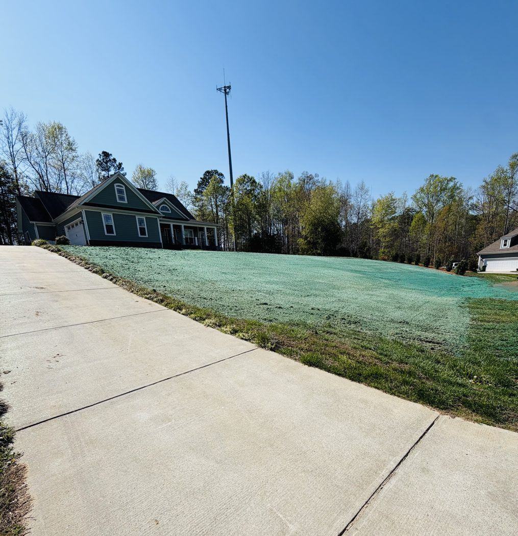 Large home with newly hydroseeded front lawn, Carolina Piedmont