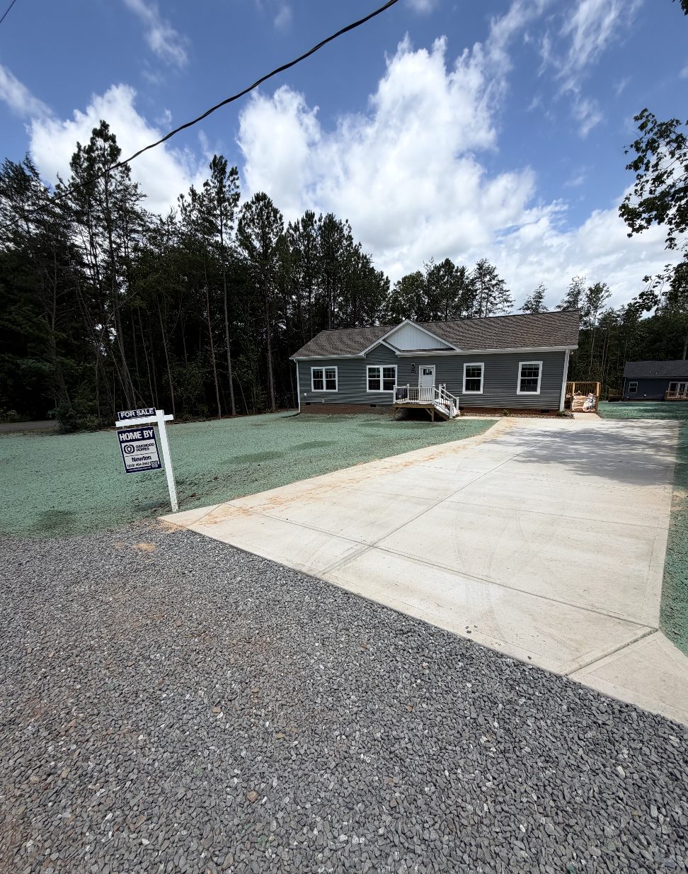 New-construction home with hydroseeded lawn and concrete driveway in the NC Piedmont