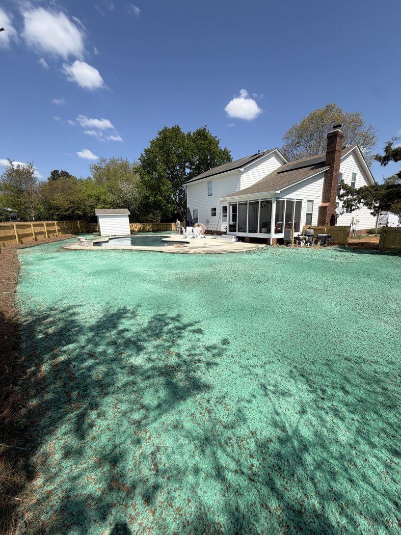 Pool backyard with fresh hydroseeded grass