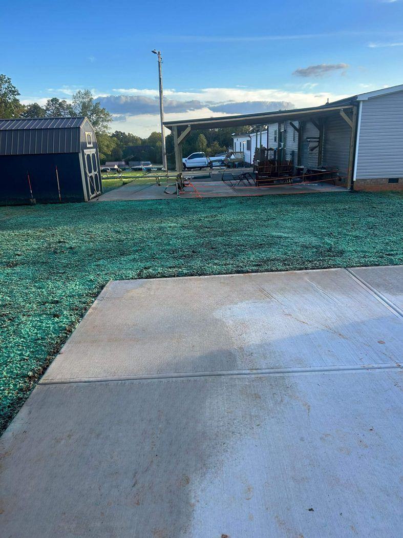 Hydroseeded backyard beside a covered porch, Catawba County NC