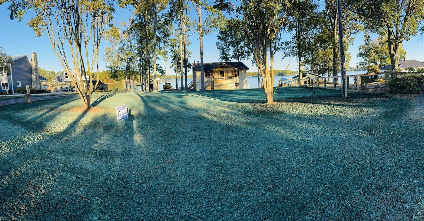 Winter lakefront view with freshly hydroseeded yard, NC